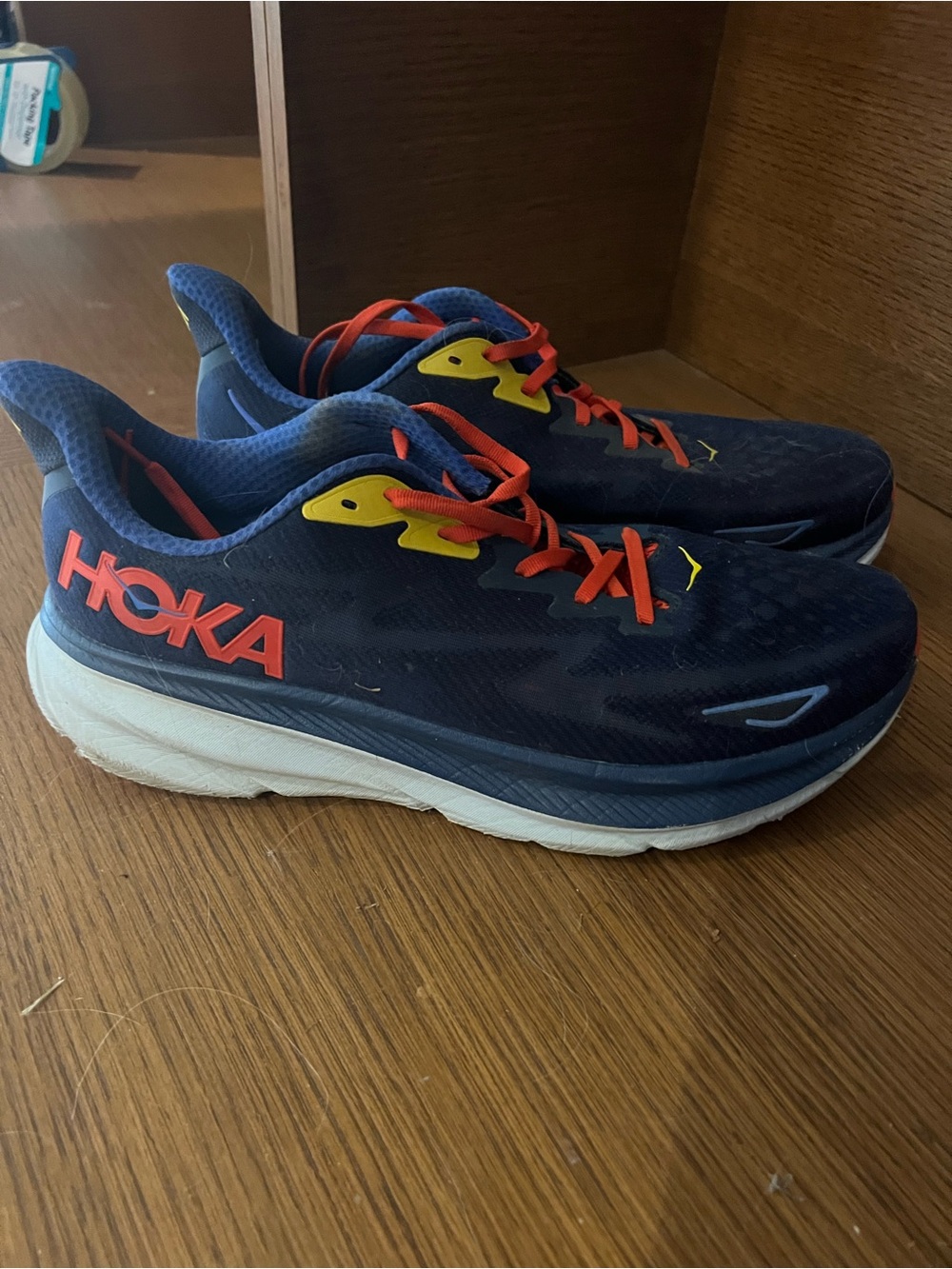 HOKA men’s ' Navy Running Shoes with Coral Accents